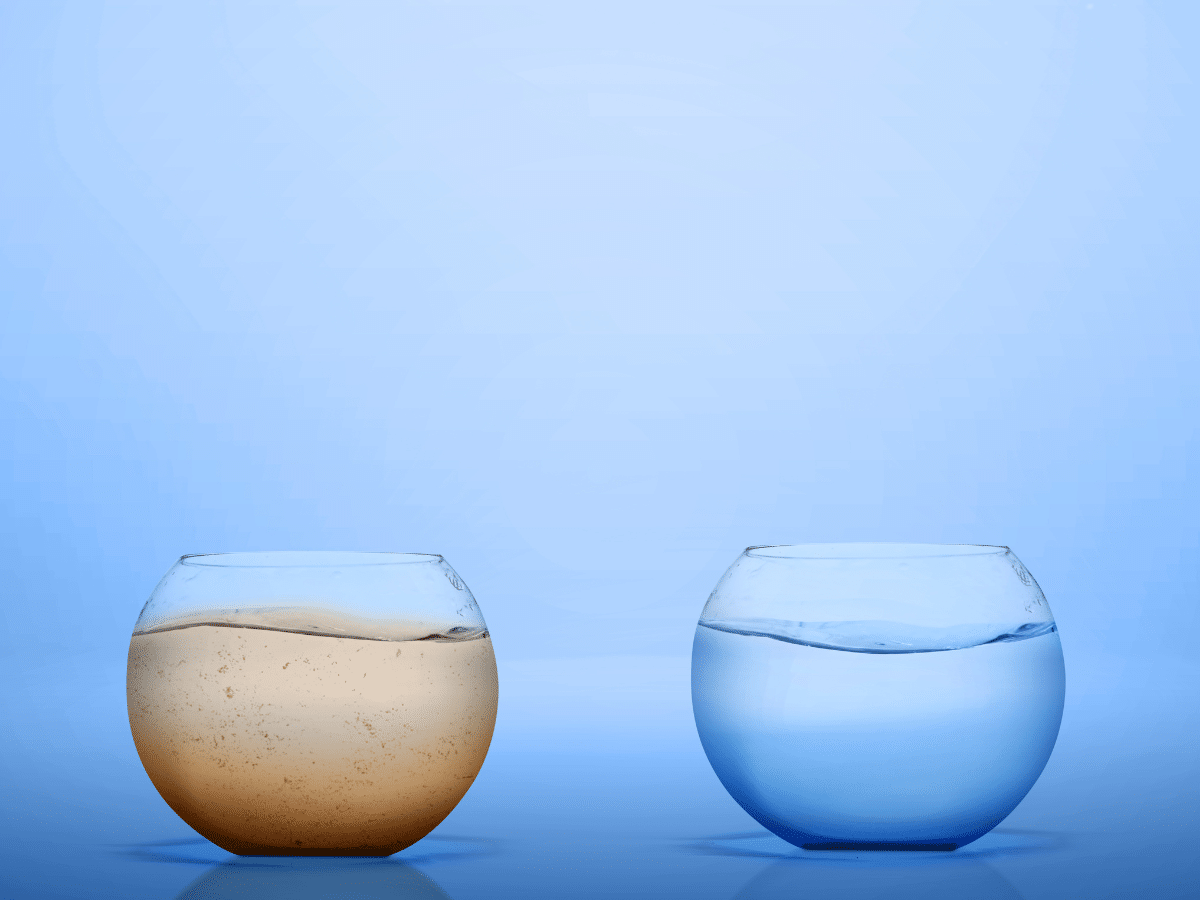 Glass of filtered water beside glass of unfiltered tap water